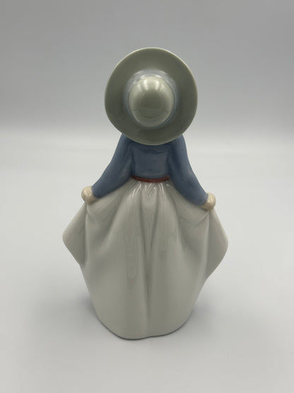 NAO by Lladro "Girl Picking Up Her Skirt" #1290